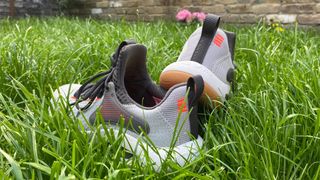 Under Armour HOVR Rise 4 cross training shoes on grass