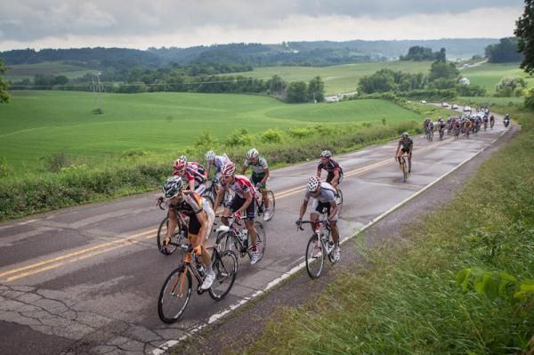 The front of the mens field starts to split with the break up the road.