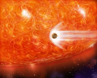 This artist's impression shows a red giant engulfing a Jupiter-like planet as it expands.