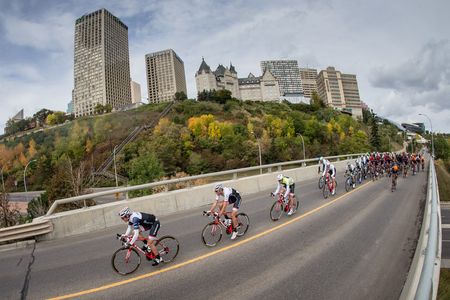 The peloton passes by the landmark Macdonald Hotel