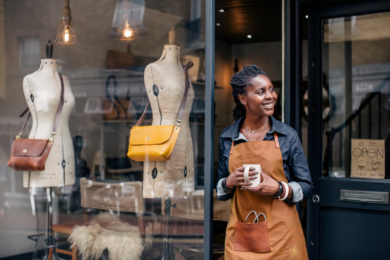 Black Pound Day: Woman standing outside clothing store