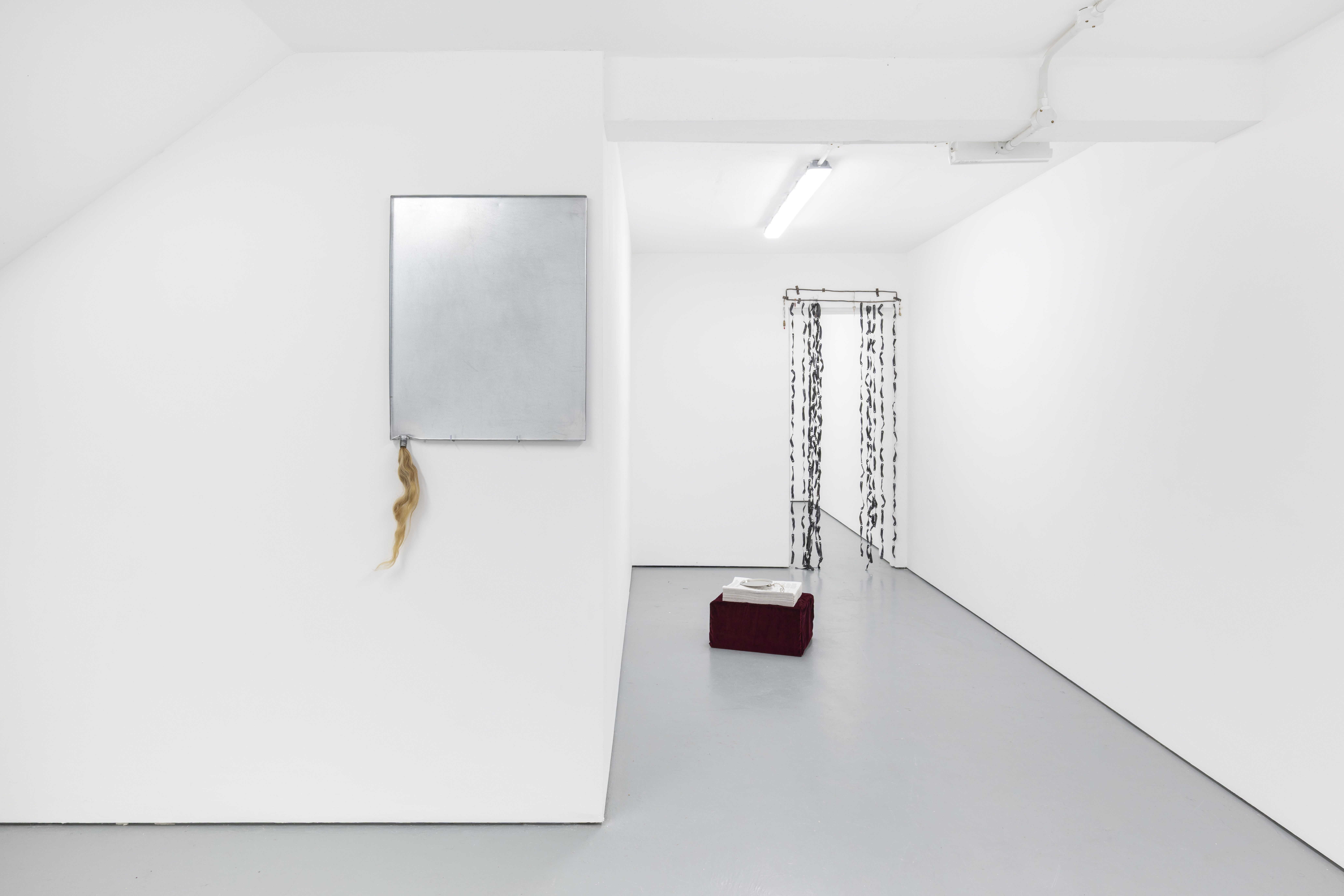 CREDITS: In the picture artworks from left: Untitled, 2026 Galvanised steel, human hair; Queer Mutations, 2026 Velvet, foam cushion, stacked newsprint,engraved nickel communion tray; Martyr (self-diagnosed), 2026 Hanging curtain in aged copper