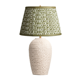 large table lamp with white scalloped base and green shade