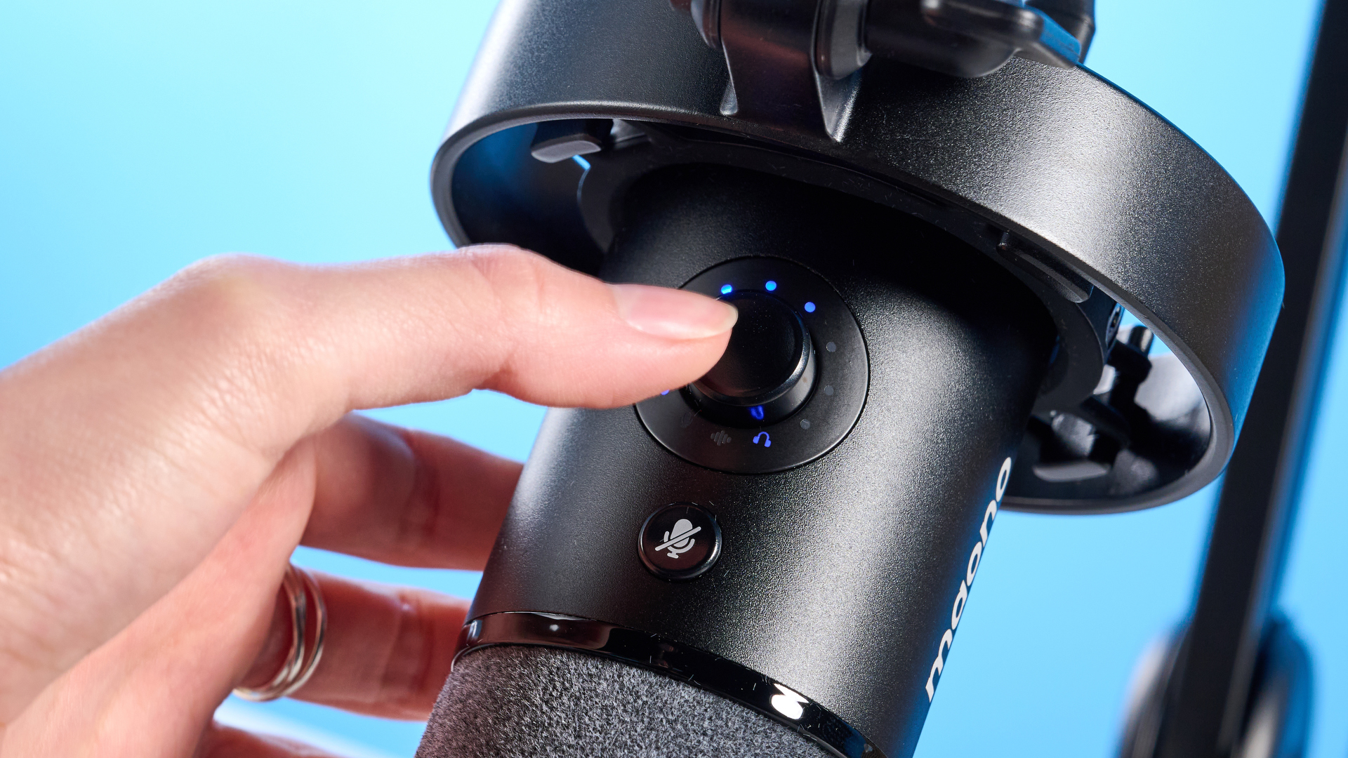 the maono pd1300x microphone for podcasting with an xlr and usbc connection and a boom arm in the photograph but also available with a desktop stand, one button dial on the mic and a muting button