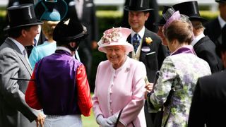 Queen Elizabeth II is welcomed upone her arrival on day 2 of Royal Ascot
