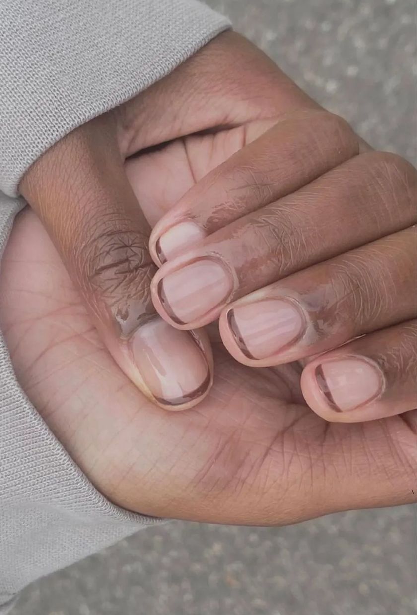 a brown French manicure