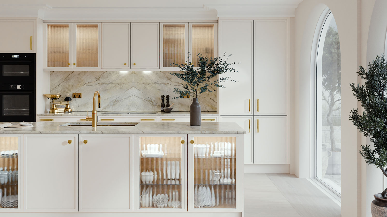 white kitchen with marble worktops and arched glazed opening