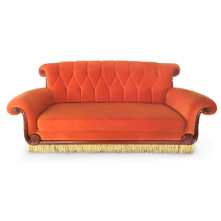Orange Central Perk coffee shop statement couch from Amazon. 