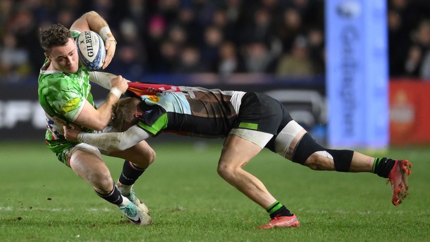 Leicester Tigers rugby player is tackled by a Harlequins player in the Gallagher Premiership.