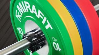 Mirafit coloured weight plates on a barbell