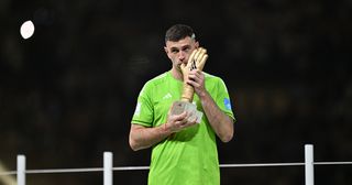 Manchester United target Emiliano Martinez of Argentina receives Golden Glove prize during an award ceremony held after Argentina beat France with penalty shootout to win 2022 FIFA World Cup at Lusail Stadium on December 18, 2022 in Lusail City, Qatar.
