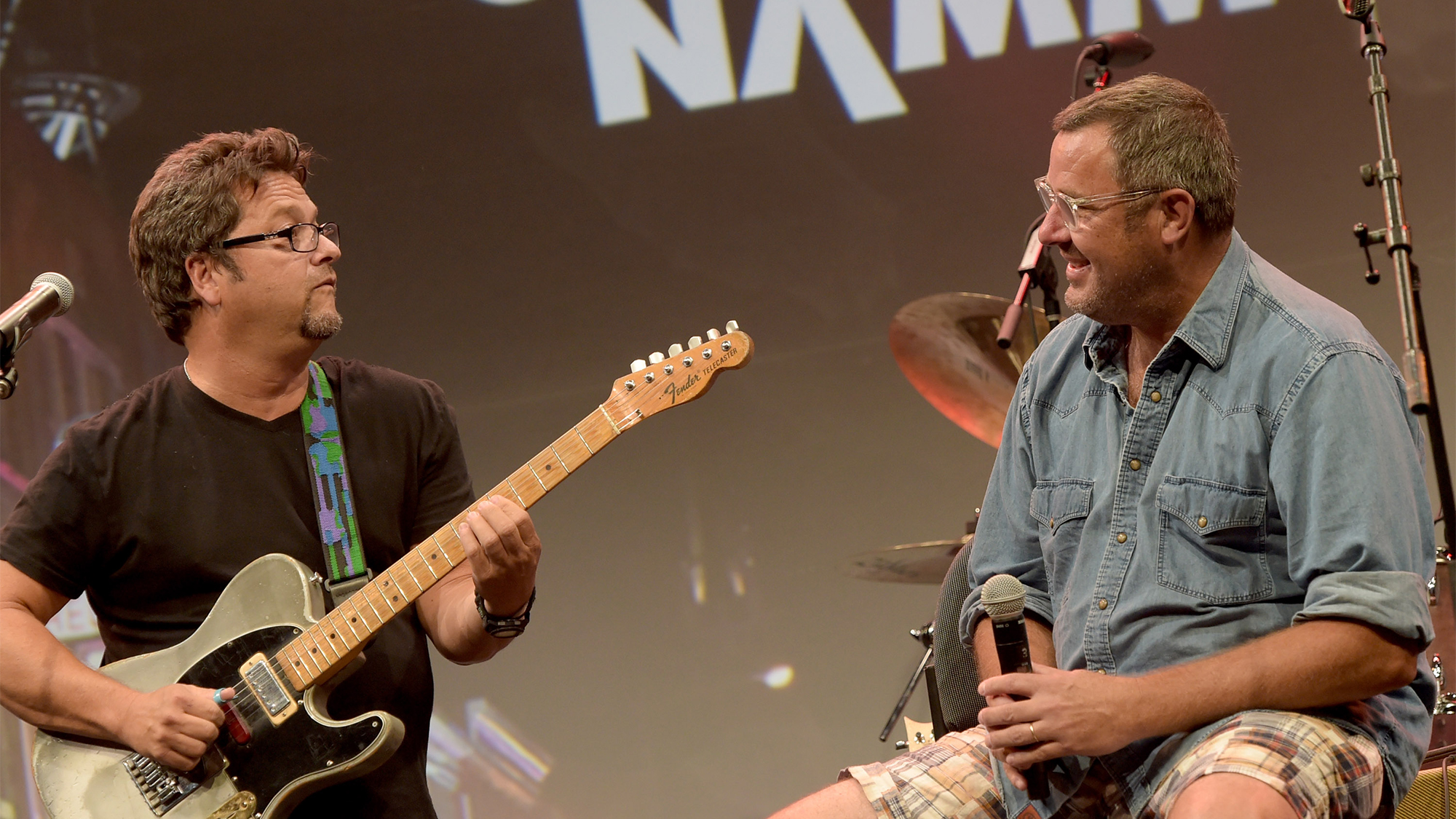 Brent Mason chats Vince Gill during Vince Gill Hosts &quot;Insight: Iconic Artists And The Gear That Inspires Them&quot; To Kick Off Summer NAMM, July 17-19 In Nashville at Music City Center on July 16, 2014 in Nashville, Tennessee.
