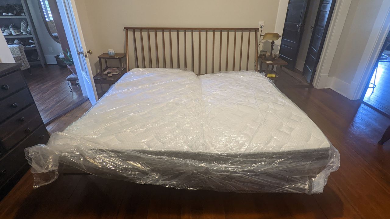 Ghostbed Luxe mattress unrolled, in plastic