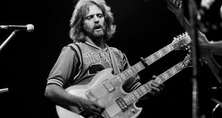 Don Felder plays a white double-neck onstage with the Eagles in 1979