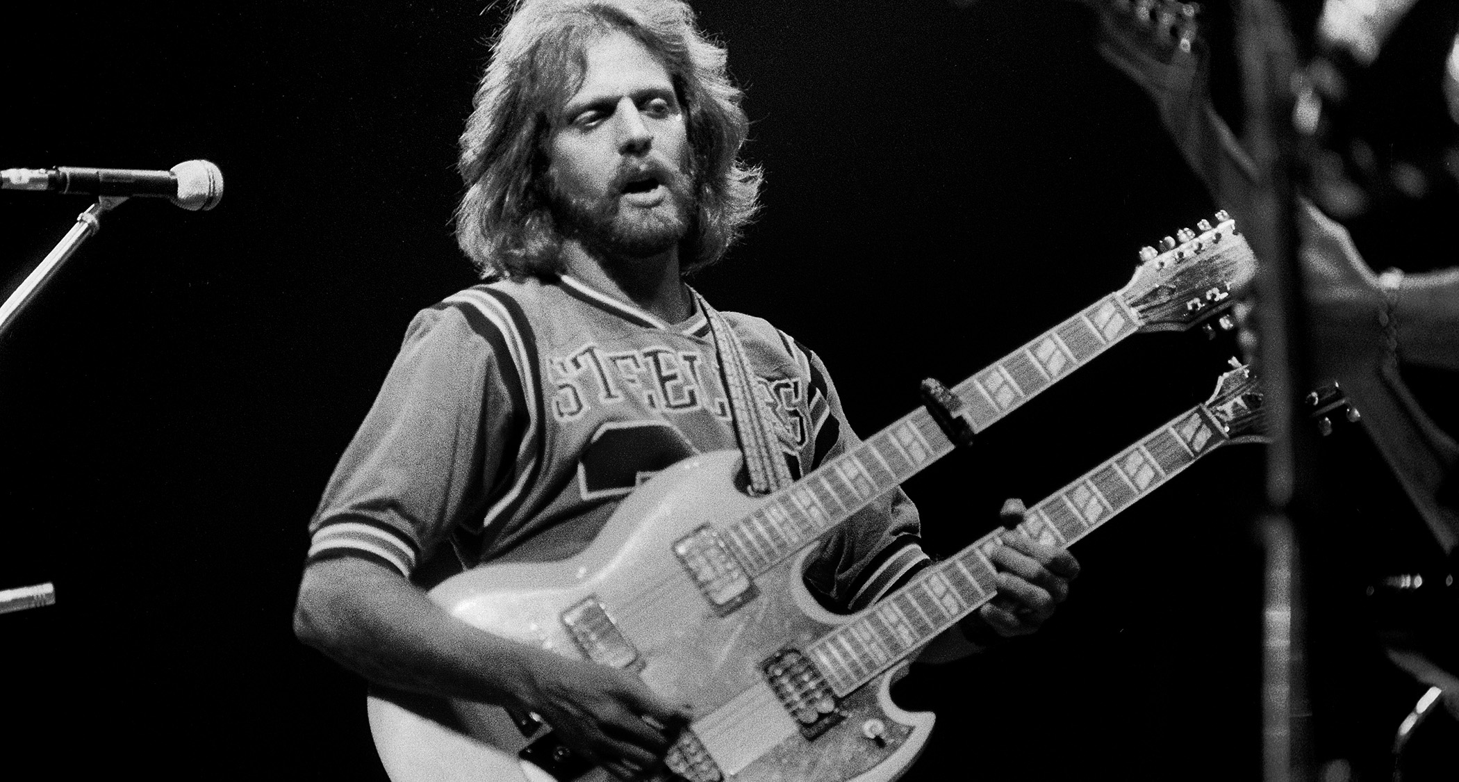 Don Felder plays a white double-neck onstage with the Eagles in 1979