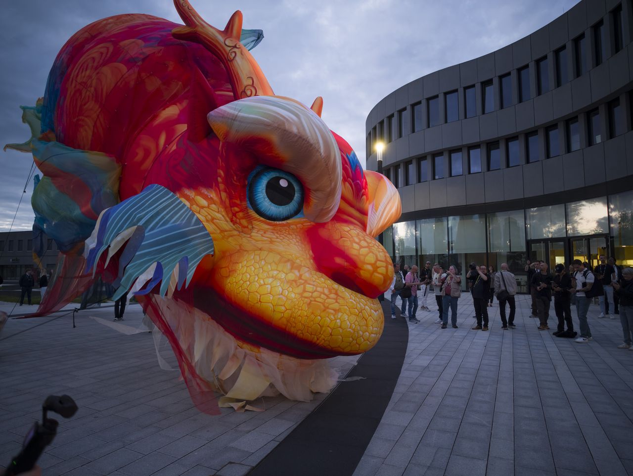 Insta360 Luna Ultra sample gallery: large inflated Chinese dragon in urban area at blue hour