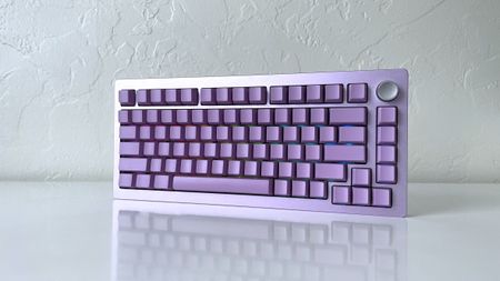 The Epomaker Tide 75 mechanical keyboard in lavender purple on a white table