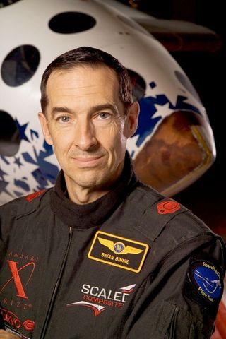 Scaled Composites' test pilot Brian Binnie poses in the flight suit he wore on SpaceShipOne to win the Ansari XPrize in 2004.