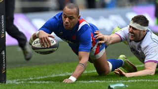 France's centre Gael Fickou (left) scores a diving try for France during the 2023 Six Nations