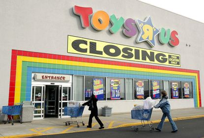 Shoppers enter a closing Toys R Us store