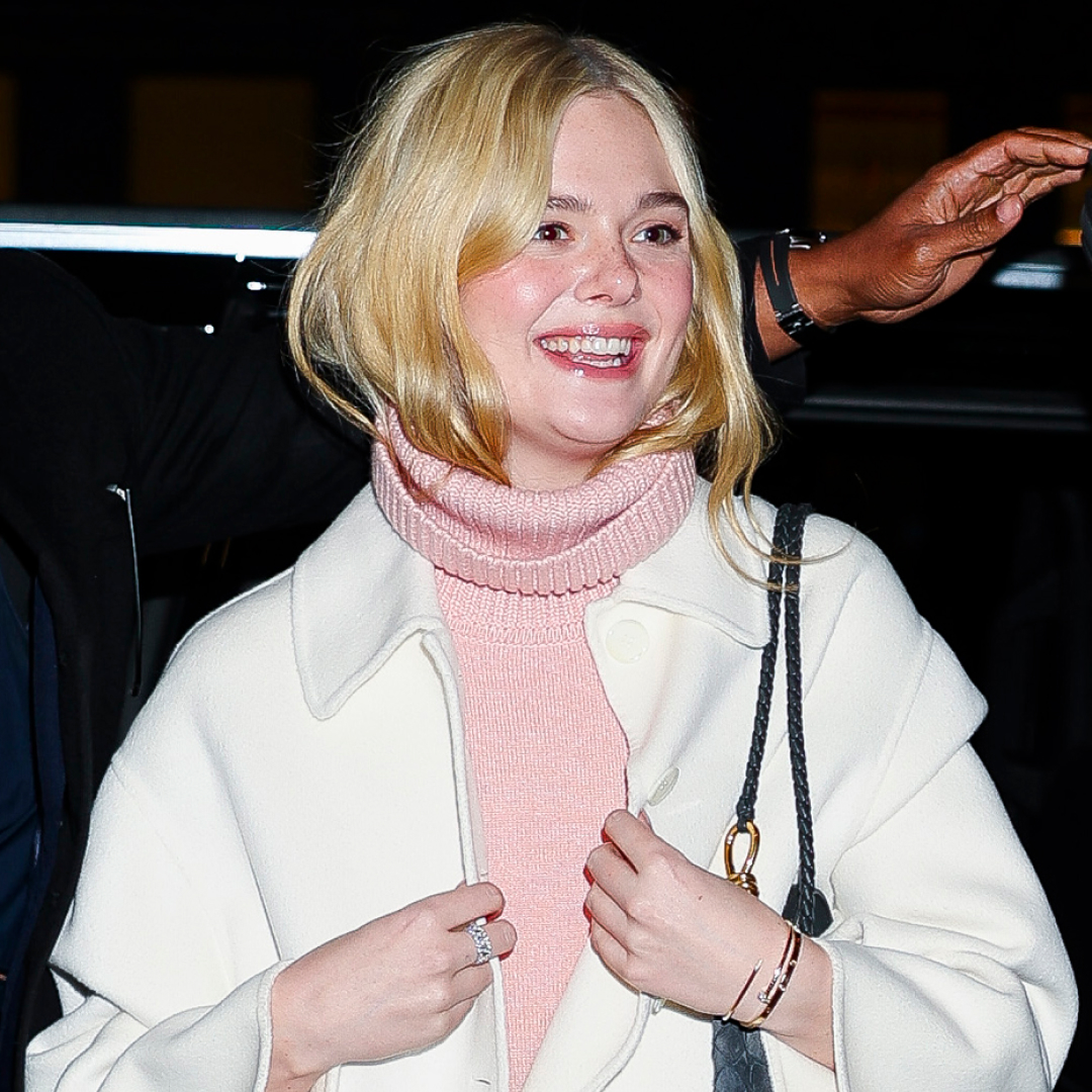 Elle Fanning was spotted in NYC wearing a turtleneck take on the dress over pants trend