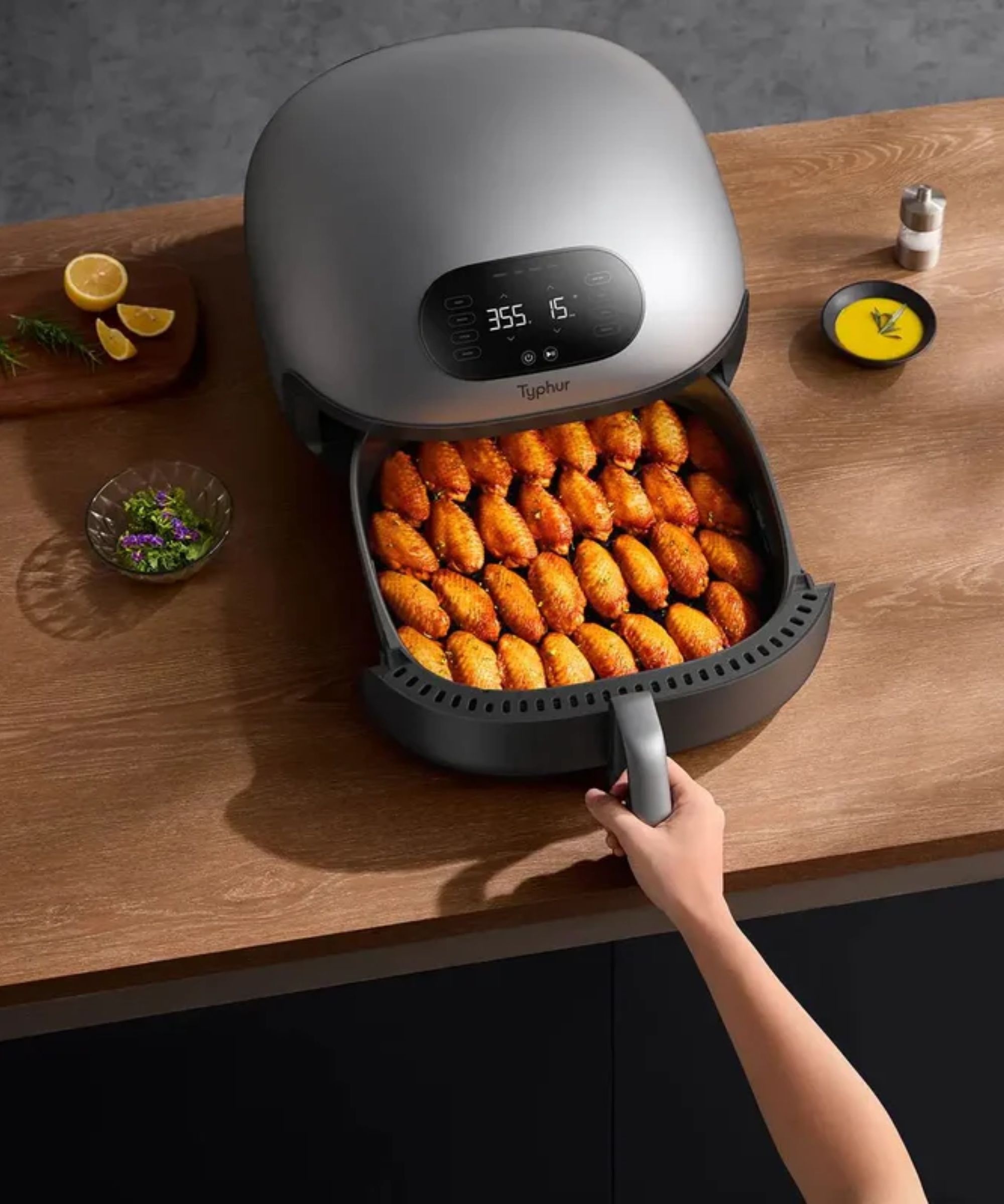Silver domed air fryer on wood kitchen island
