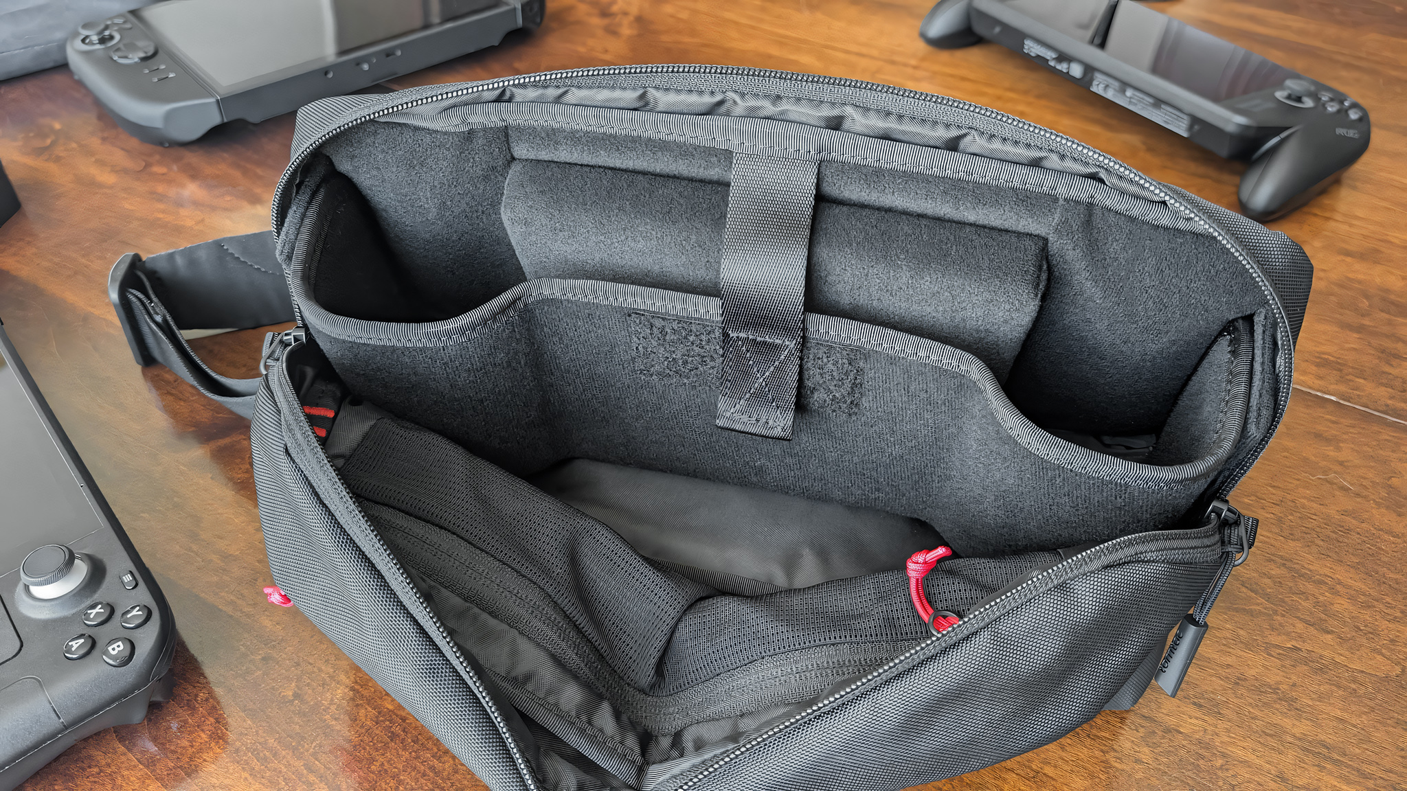 The Tomtoc Arccos G-47 Travel Bag unzipped to view interior storage.