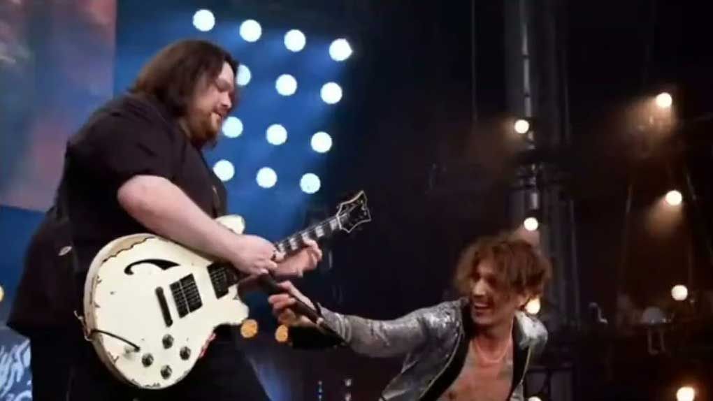 Wolfgang Van Halen and Justin Hawkins onstage