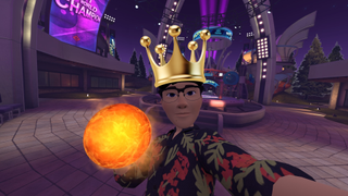 Hamish hector holds a flaming bowling ball while wearing a gold crown