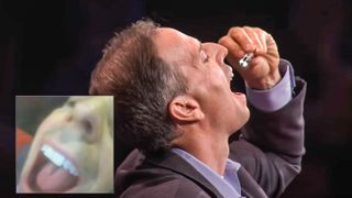 Alex Luebke swallowing PillBot on stage during TED talk