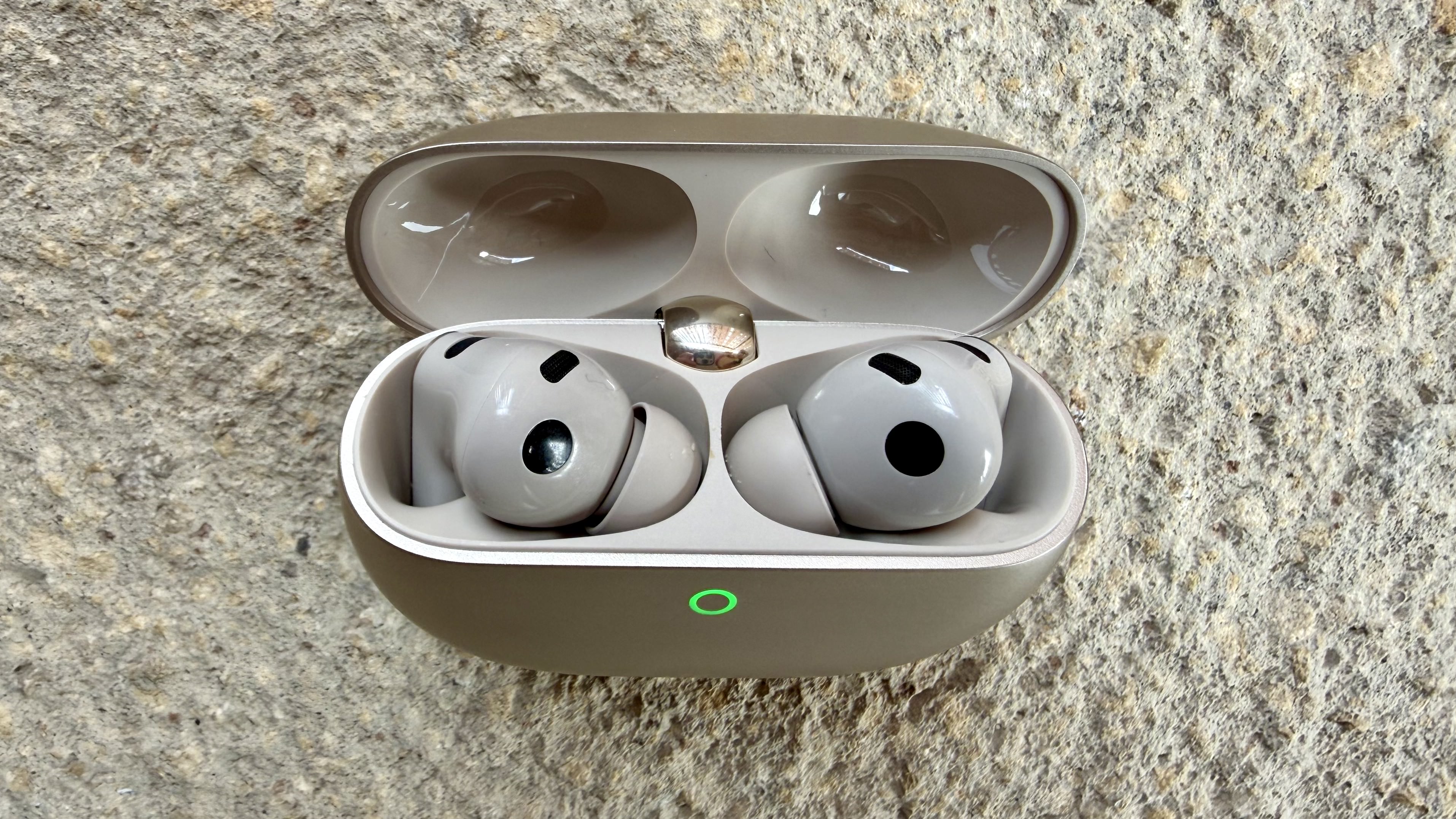 The Huawei FreeBuds Pro 5 buds pictured from above in their charging case with the light on