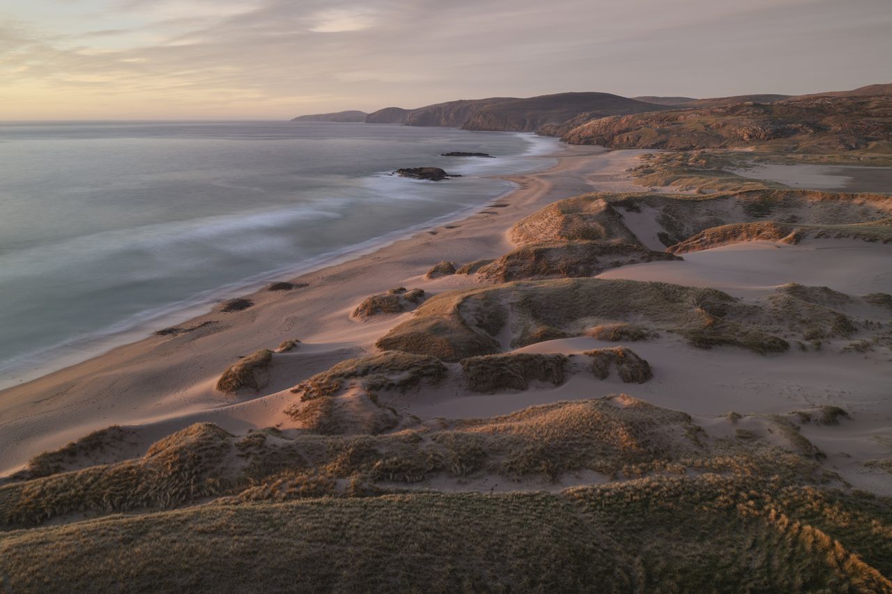 Embrace the wind, the dunes and the waves at Sandwood Bay in Sutherland.