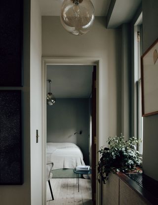 a hallway and bedroom with a subtle limewash finish
