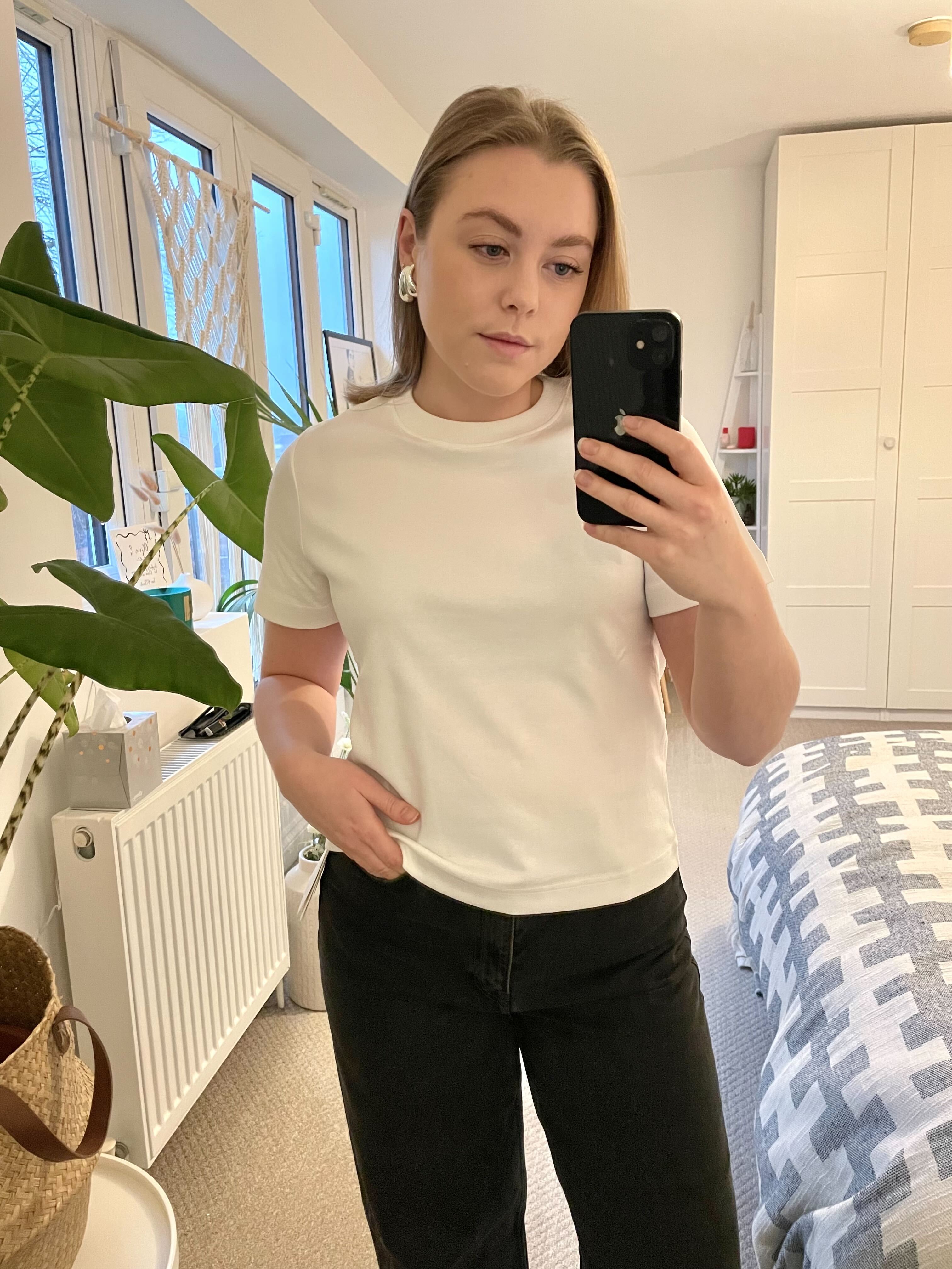 Florrie wears the COS Clean Cut T-Shirt and COS Arch Tapered Jeans