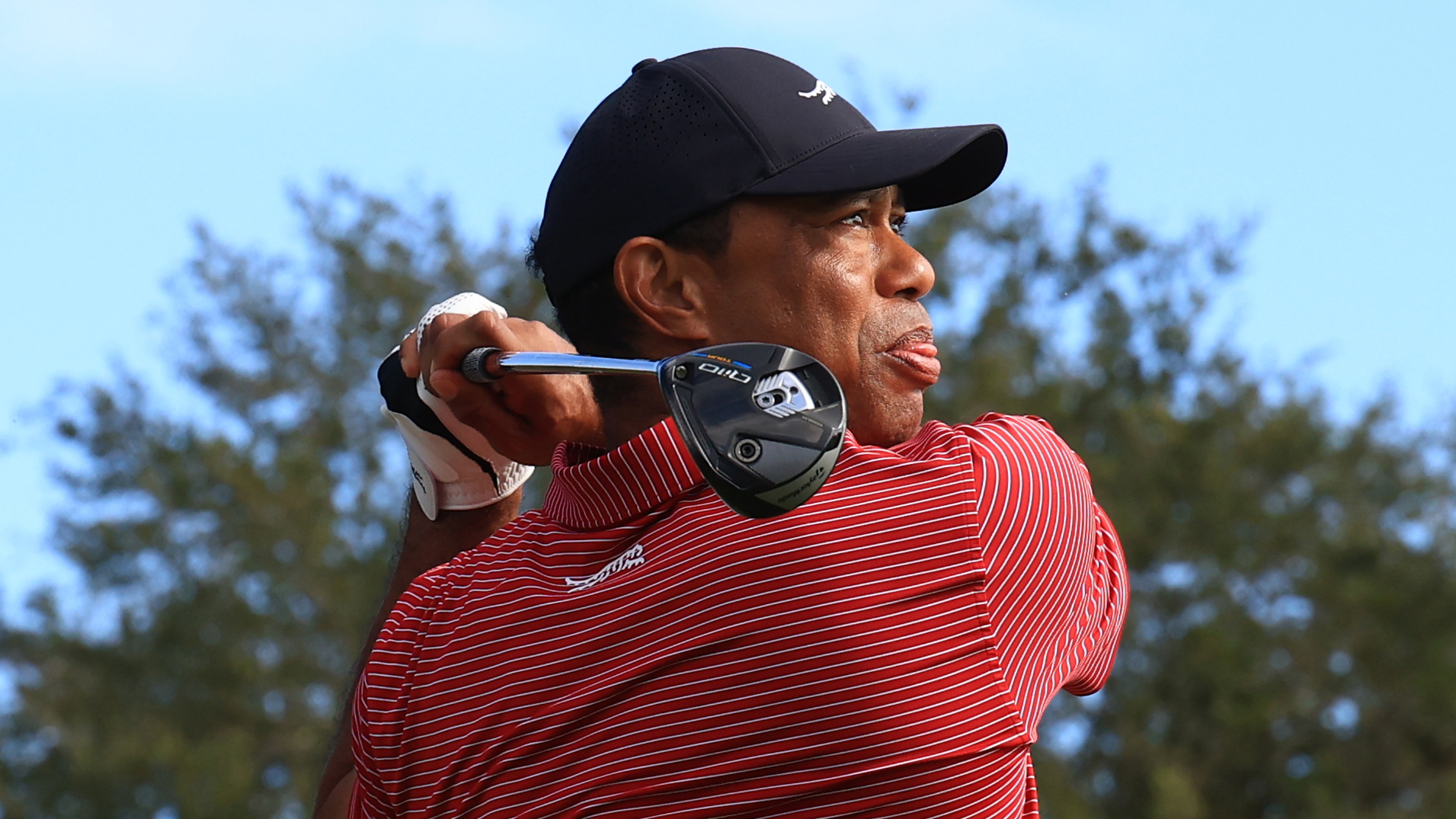 Photo of Tiger Woods using a 3 wood