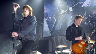 Mark Lanegan and Josh Homme of Queens of the Stone Age performing at the 2002 KROQ Almost Acoustic Christmas