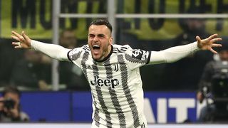 Filip Kostic of Juventus celebrates after scoring the team's first goal during the Serie A match between FC Internazionale and Juventus at Stadio Giuseppe Meazza on March 19, 2023 in Milan, Italy.
