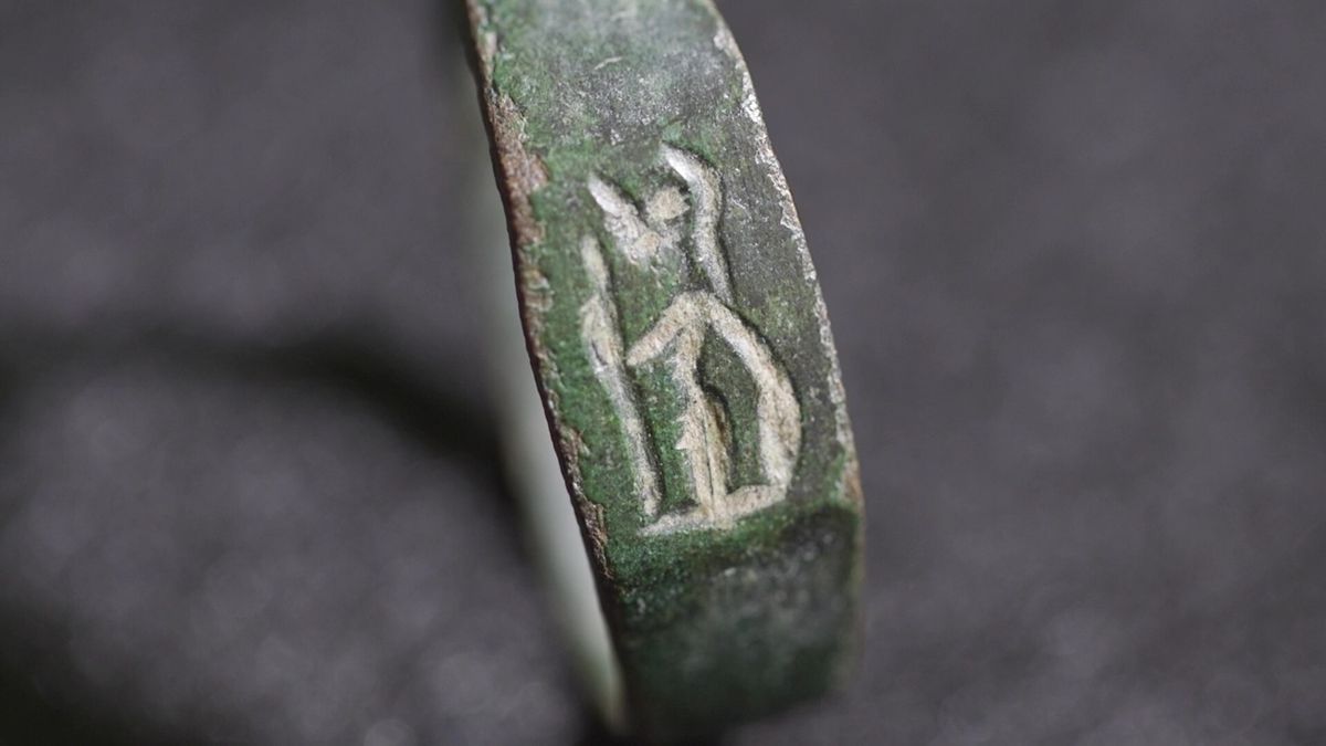 A close-up of a ring with markings on it