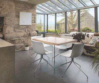 glass extension to stone cottage kitchen