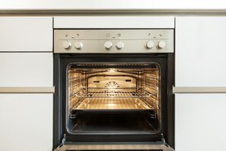 An open convection oven in a kitchen