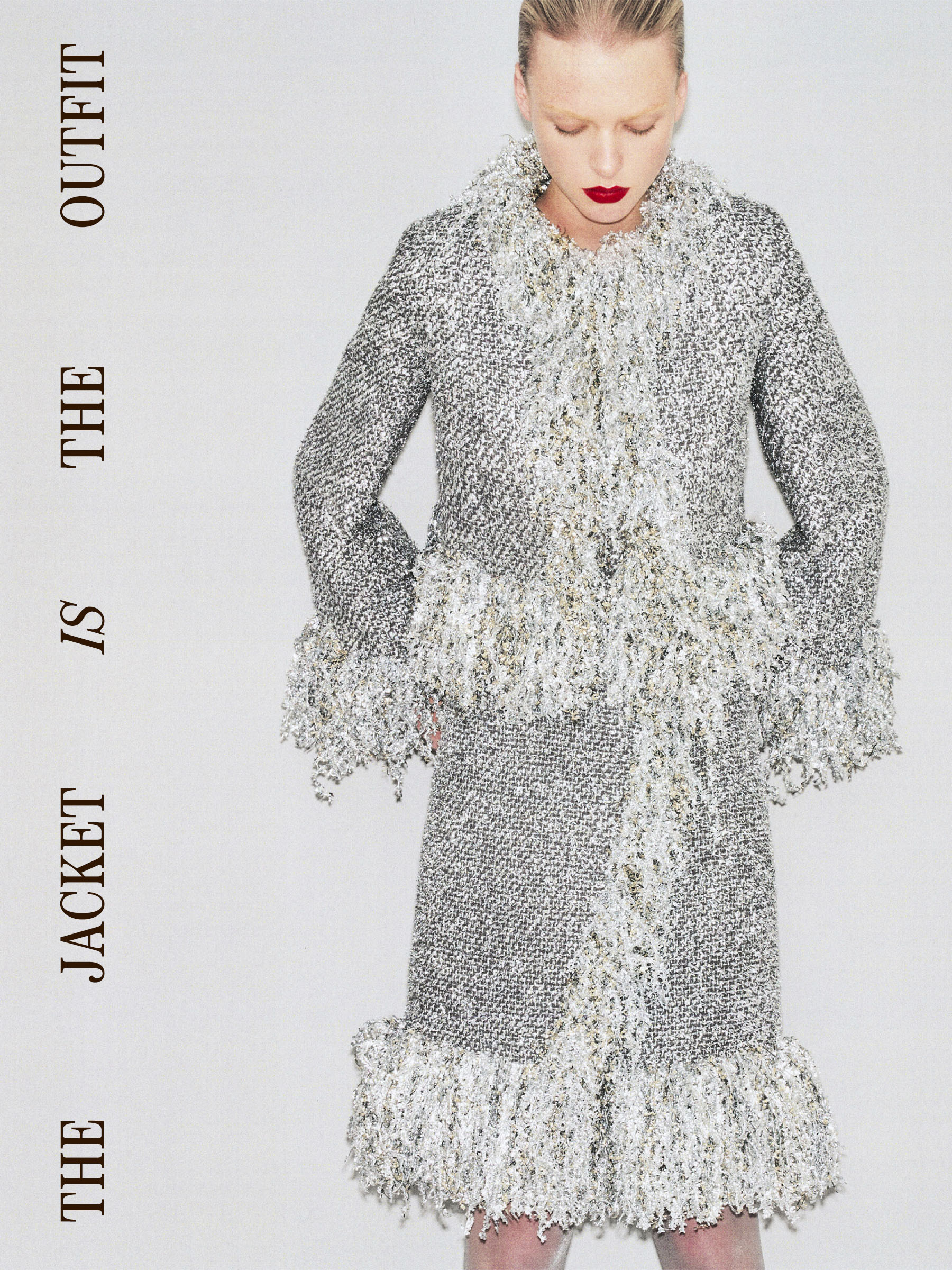 Model in a silver metallic Liberowe jacket and skirt