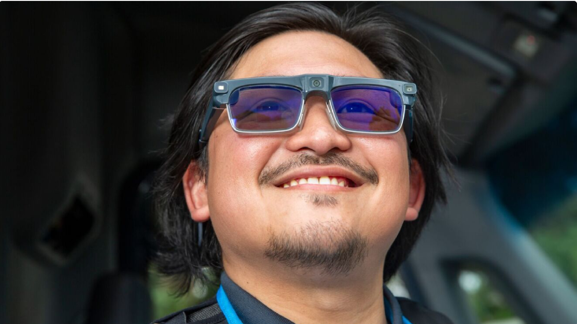 An Amazon driver wearing prototype Amazon Amelia smart glasses