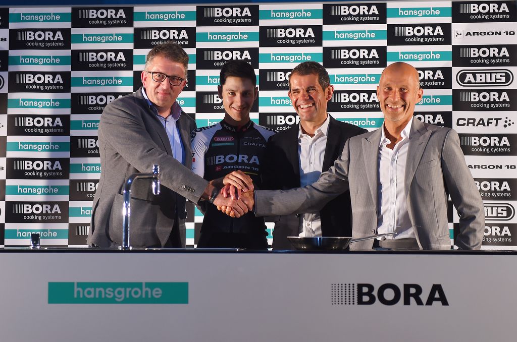 Managing Director BeLux at Hansgrohe, Philippe Harinck shakes hands with Bora founder Willi Bruckbauer