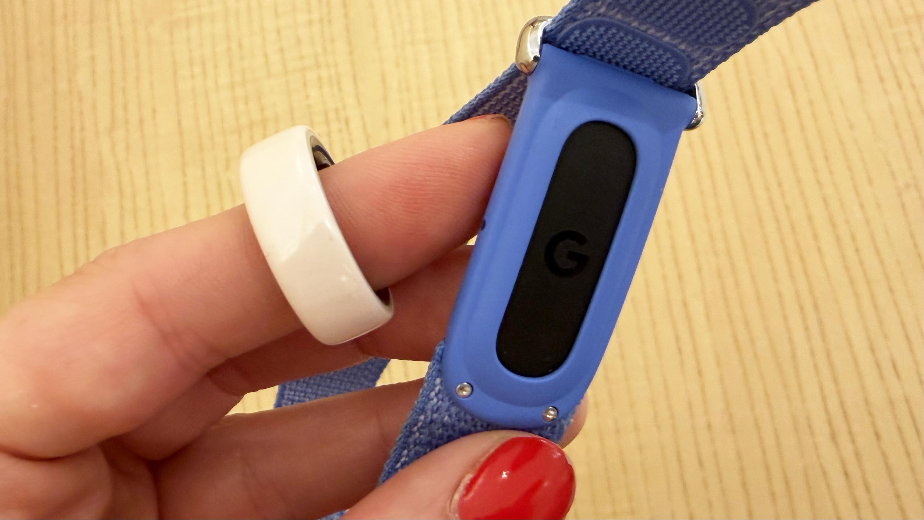 a photo of the Oura Ring 4 and Fitbit Air