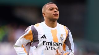 Kylian Mbappe of Real Madrid warms up during the LaLiga match ahead of Real Madrid vs Atletico Madrid in the Champions League last 16 clash