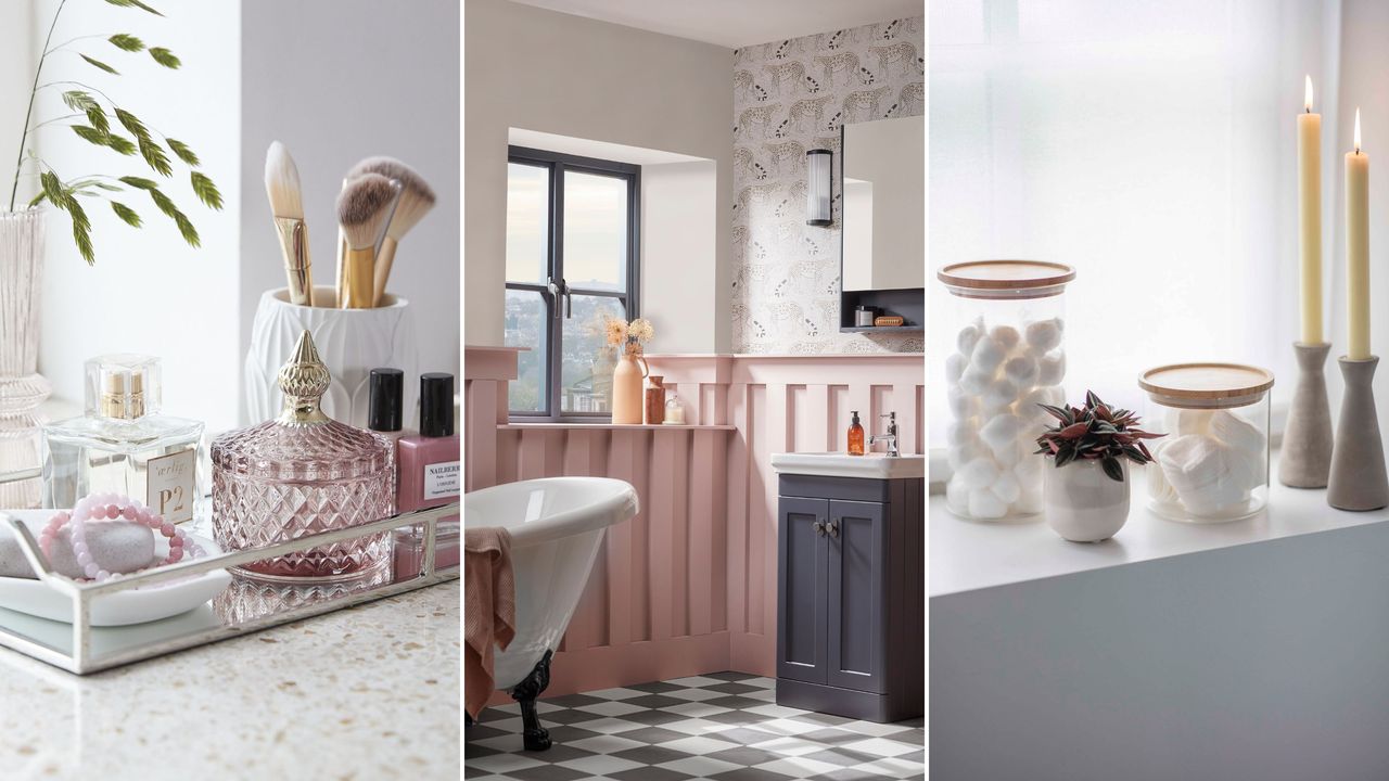  Silver tray with makeup brushes and perfume bottles on it, a white and pink bathroom with a navy blue window with a vase on it, and a white windowsill with glass jars and two candles on top