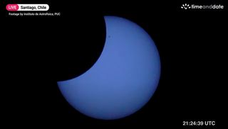 A view of the partial solar eclipse of April 30, 2022, with clearly visible sunspots, as seen from Santiago, Chile by the Institute de Astrofisica in a Timeanddate.com broadcast.