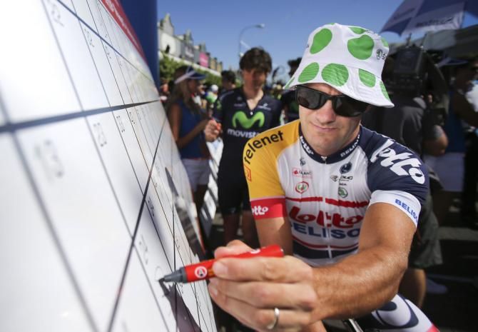 A sun-safe Greg Henderson signs in 2013