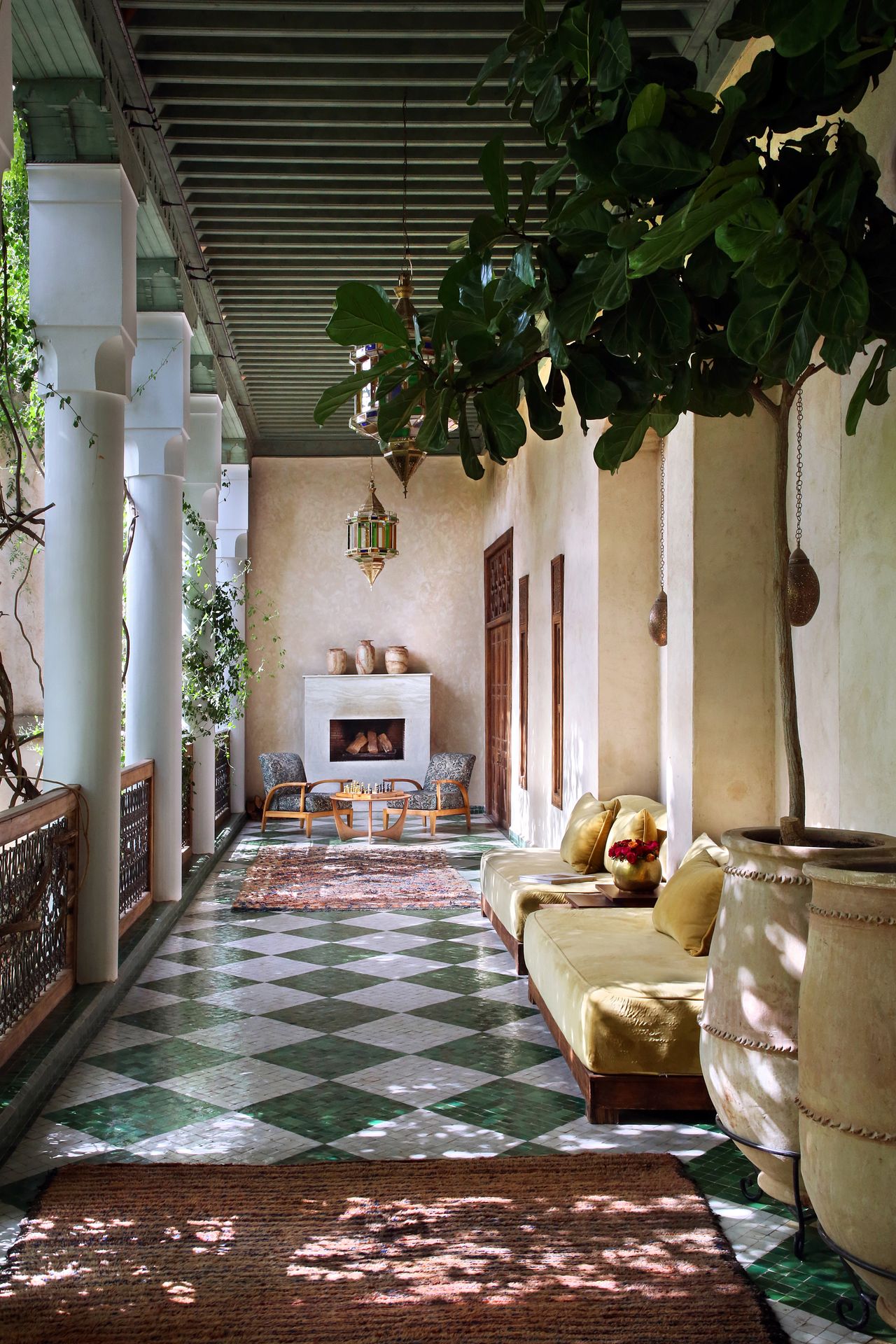 A colorful Moroccan riad has been transformed into a kaleidoscope of patterned textiles, striking artwork, and eye-catching tiles.