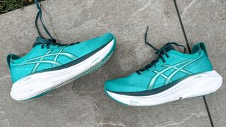 Asics Gel-Nimbus 27 laid on a sidewalk